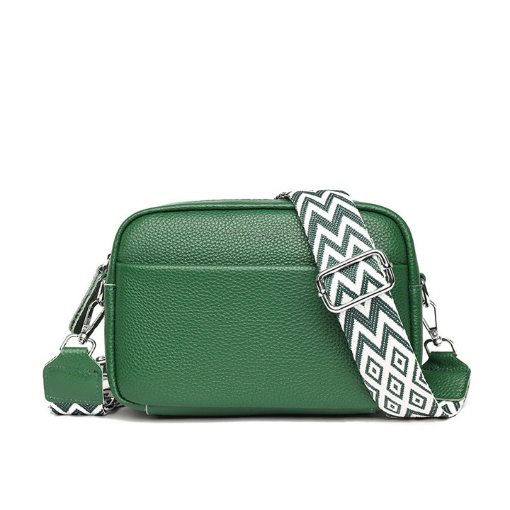 Small leather crossbody bag with patterned strap