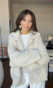 Woman in an off-white teddy jacket