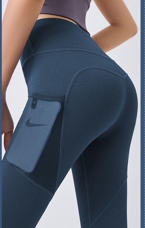 Woman wearing high-waist leggings with phone pocket