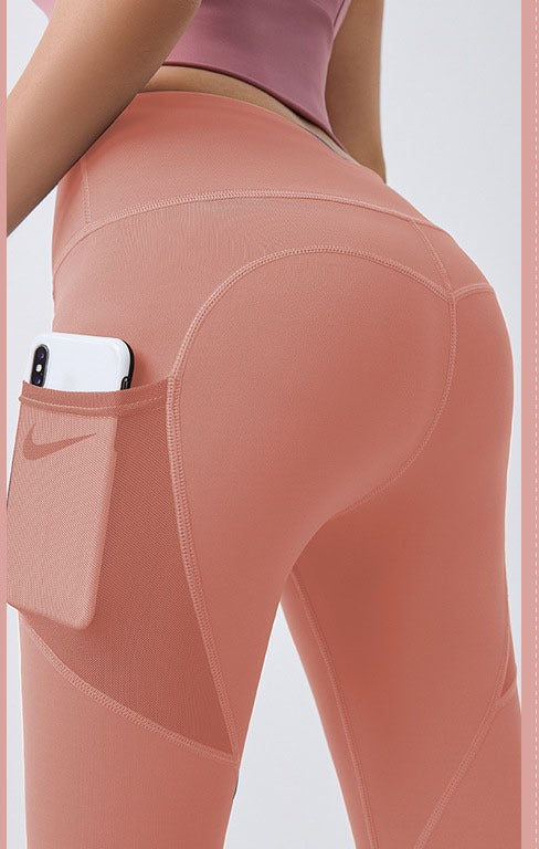 Woman wearing high-waist leggings with phone pocket