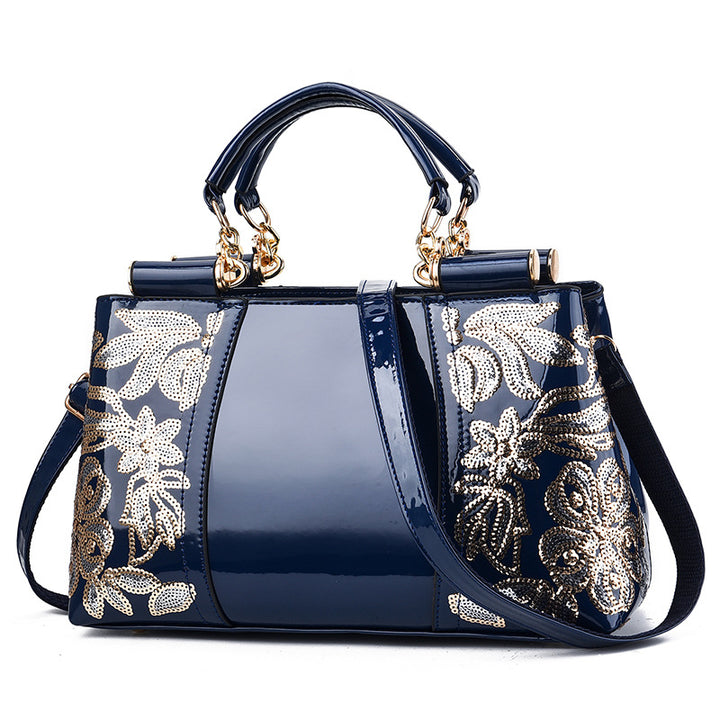 Sequin embroidered patent evening handbag